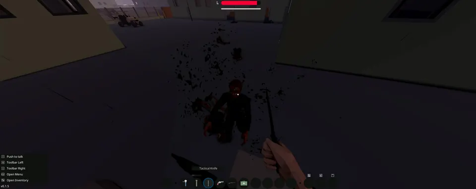 A zombie down on the ground in a dim alley, with a tactical knife raised over it