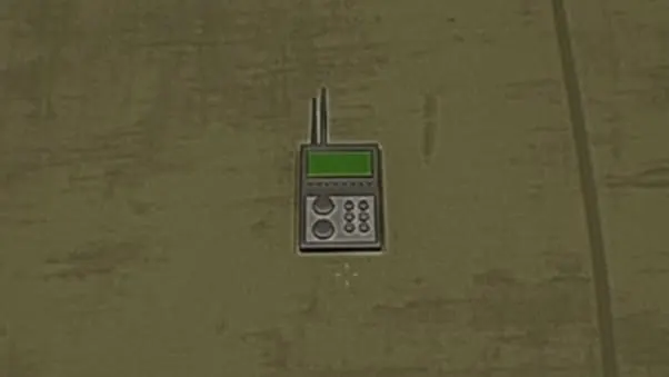 The RDF lying on the floor, a handheld unit with an antenna, a green screen and a keypad