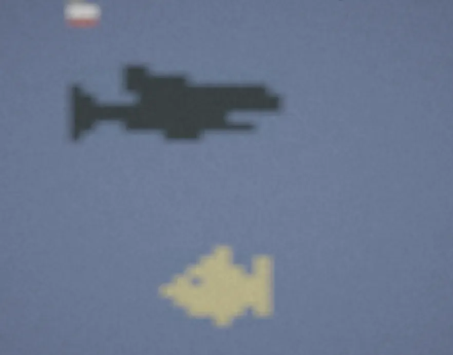 One of the arcade games: a shark chasing a small yellow fish