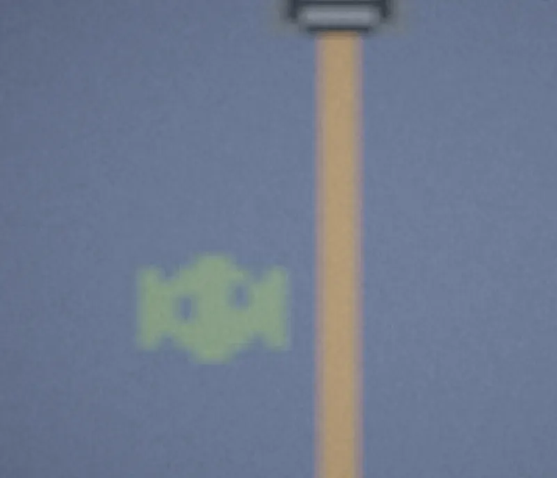 One of the arcade games: a fishing line dropping toward a green fish