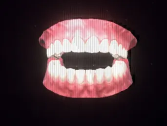 Jaw, a floating set of pink gums and white teeth with the mouth hanging open