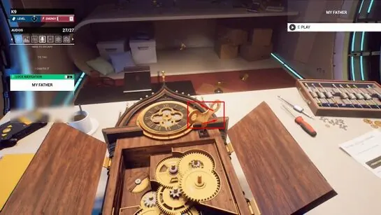Jahi's broken clock opened up, with gears fitted inside