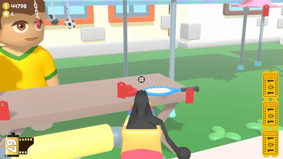 A table holding a tennis racket and an air hockey paddle